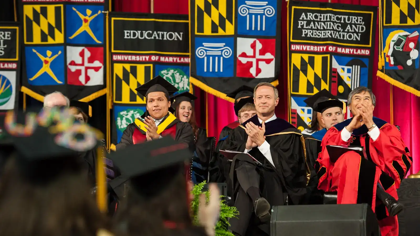 University of Maryland graduation — seated graduates in cap and gown at commencement ceremony